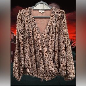 New Leopard Print Blouse, fits like a medium, but says size Lg. Never worn